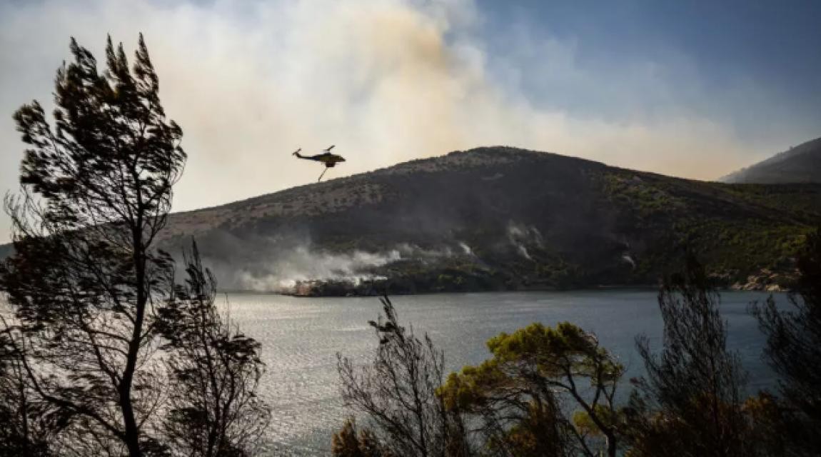 Wildfires kill two and force mass evacuation on Greek island near Athens
